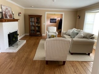 living room warm hardwood floors create a cozy livingroom/.family room space.